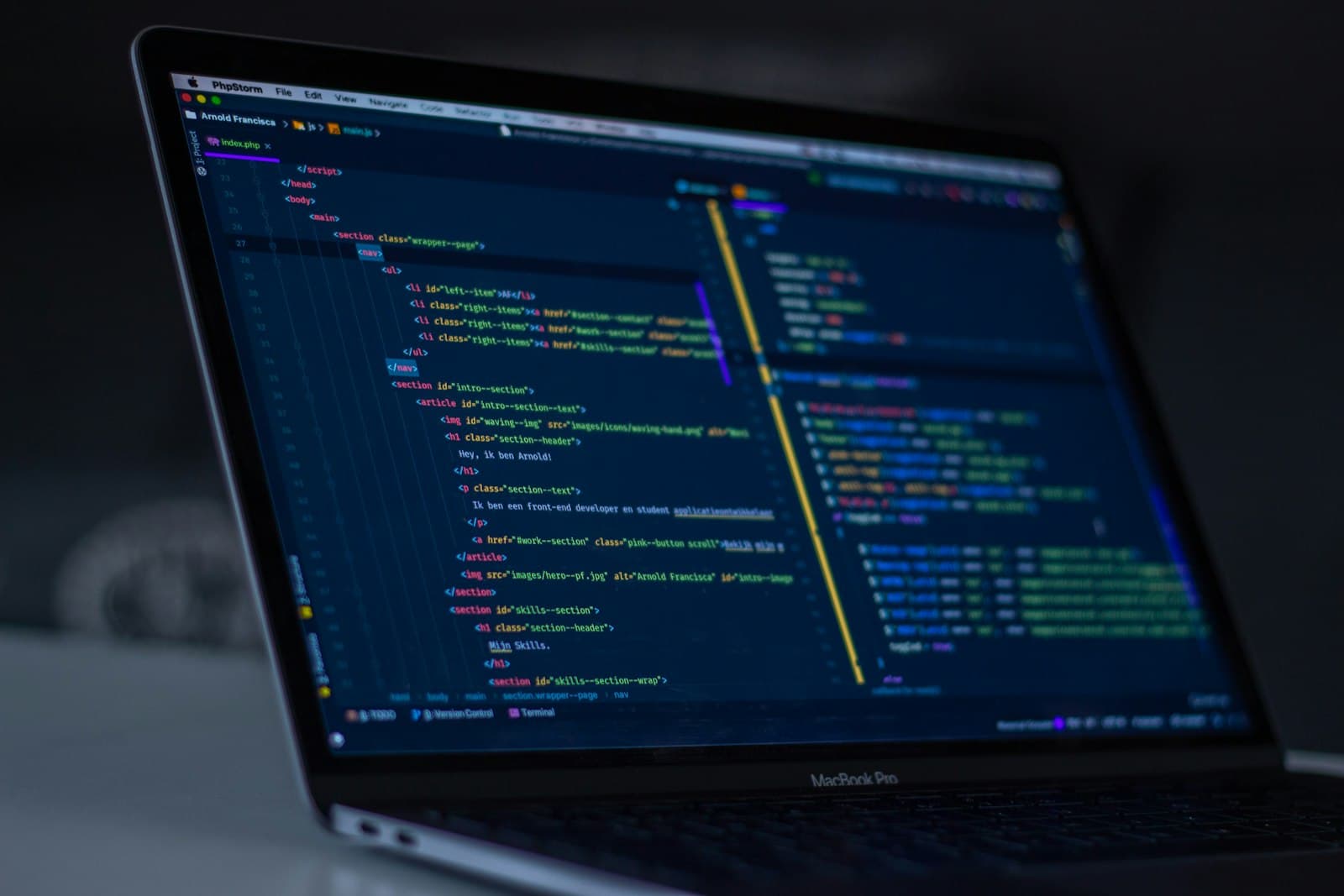 A code editor open on a laptop